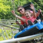 Mother and Daughter Riding Rollercoaster